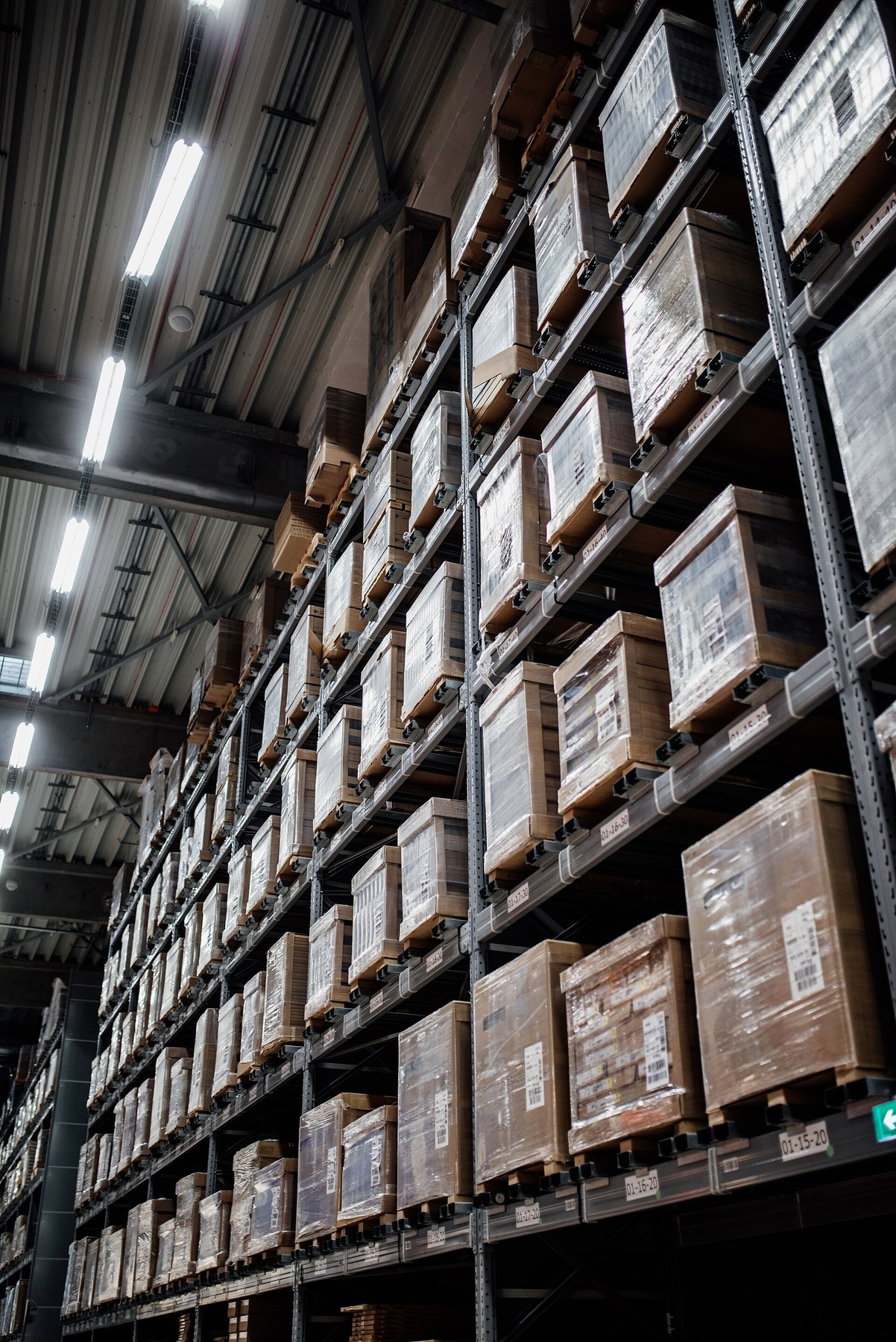 Stacked pallets on industrial warehouse shelves